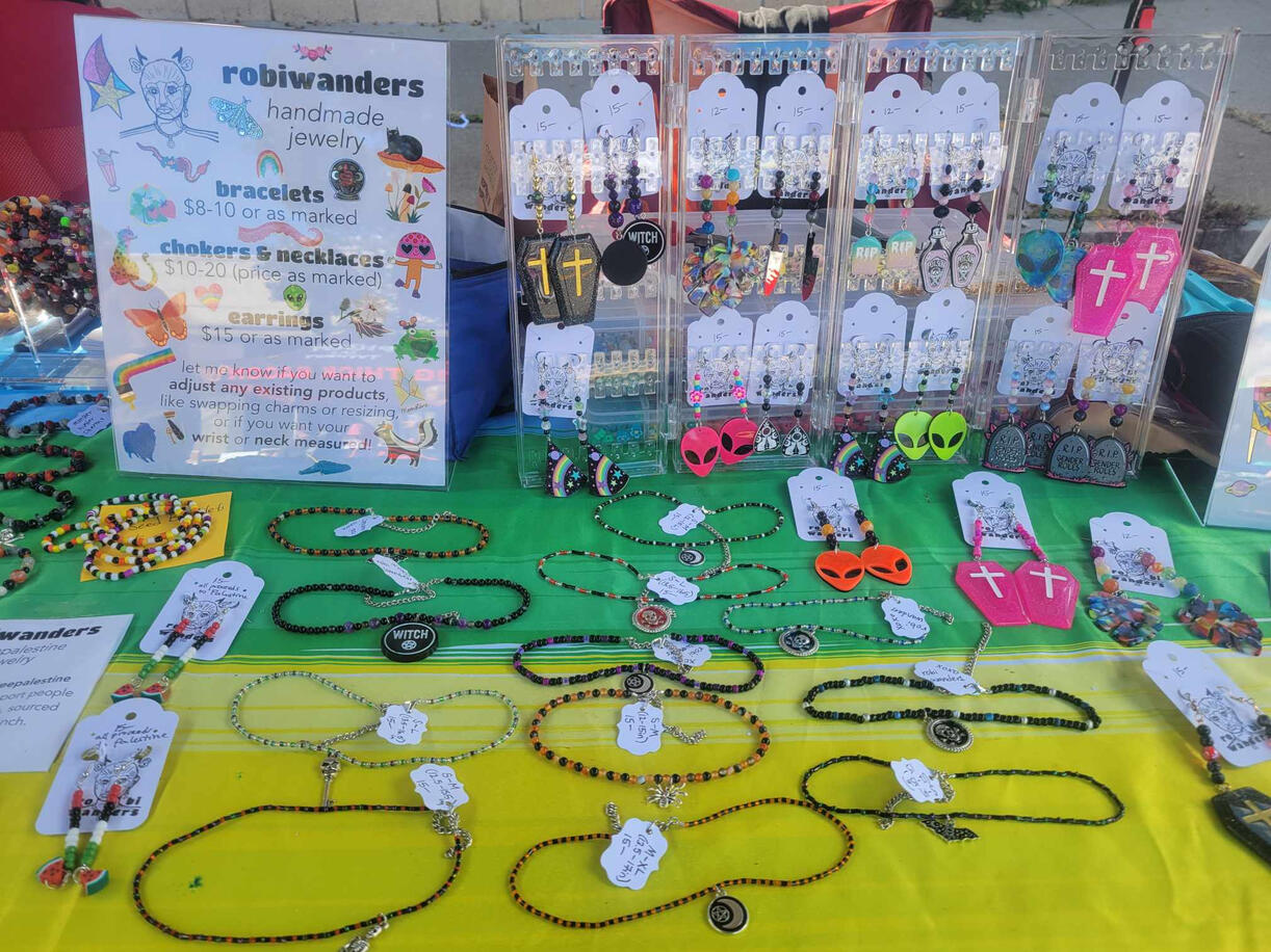 a table spread with robiwanders earrings and chokers