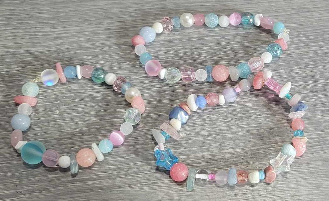 a picture of some zodiac-inspired bracelets by robi