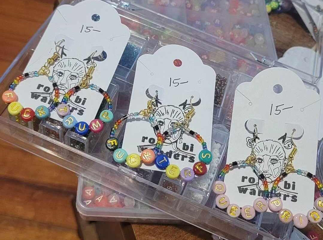 a table spread with robiwanders bracelets and chokers