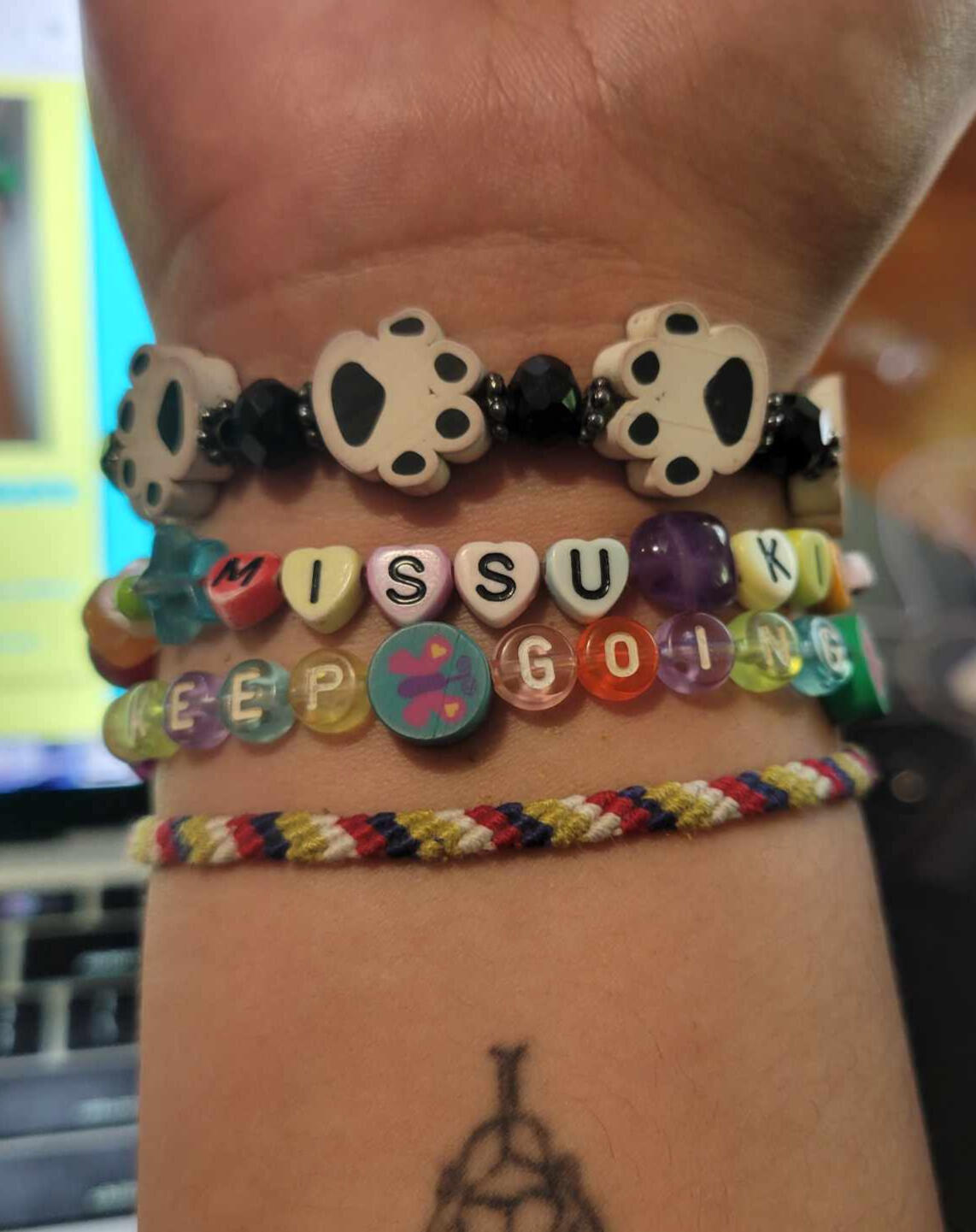 A picture of the 4 bracelets that robi wears every day.
