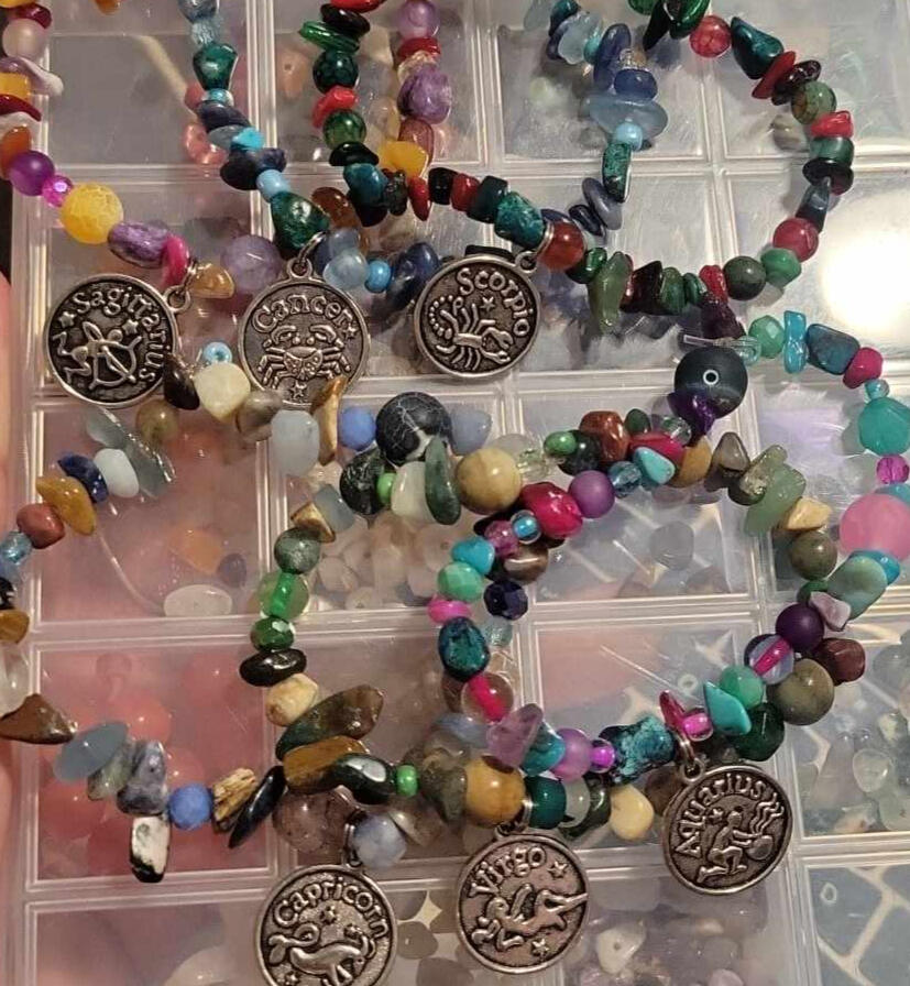 a picture of some zodiac-inspired bracelets by robi